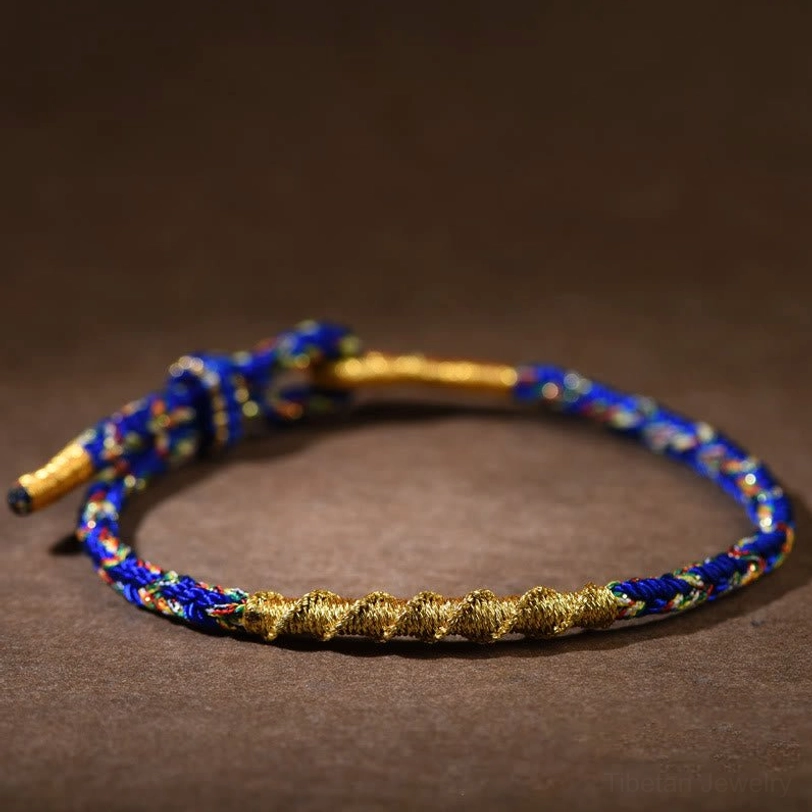 Blue and gold Tibetan zodiac natal buddha braided bracelet with adjustable knot for protection and healing