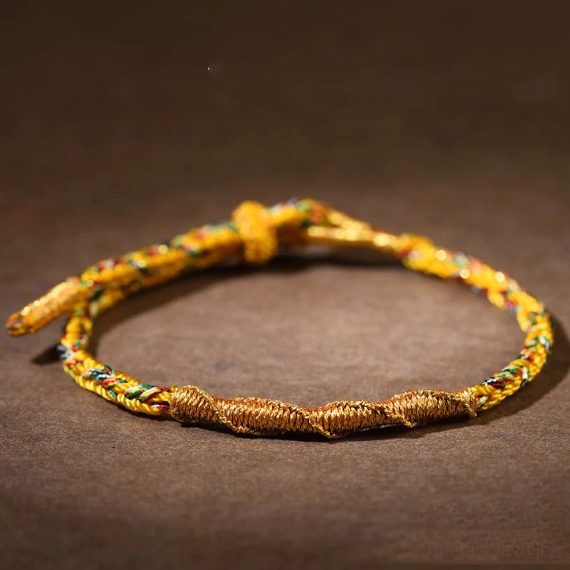 Gold Tibetan zodiac natal buddha braided bracelet with Amoghasiddhi Tathagata for Goat and Monkey signs