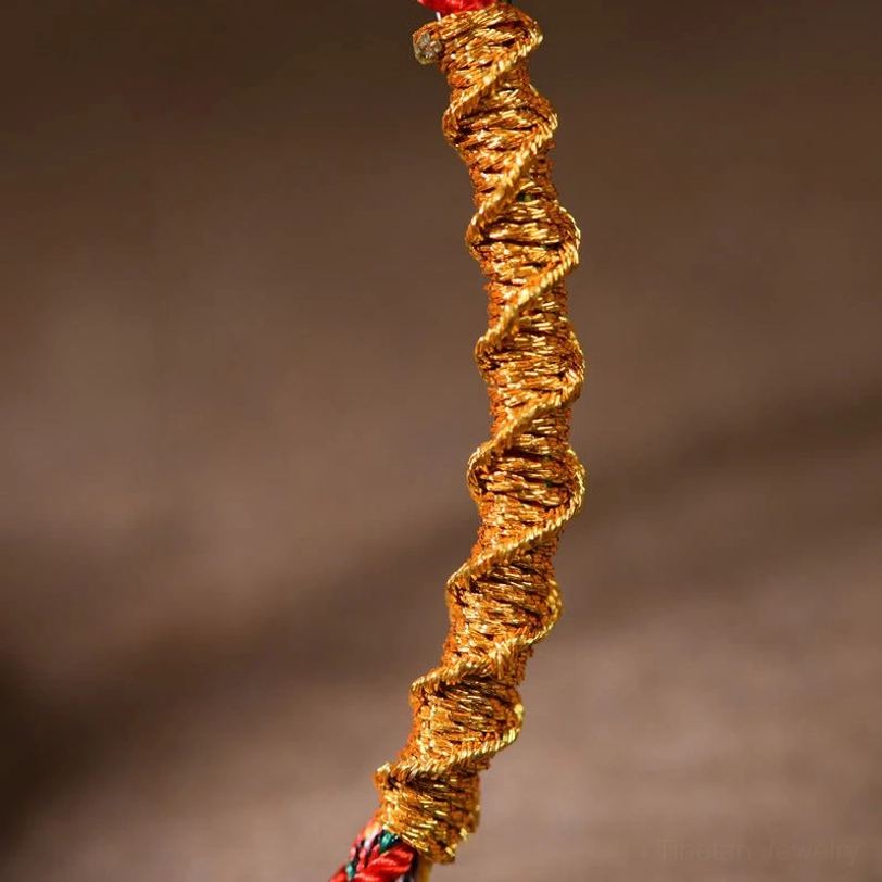 Close-up texture of thick twisted rope weave in Tibetan zodiac natal buddha braided bracelet