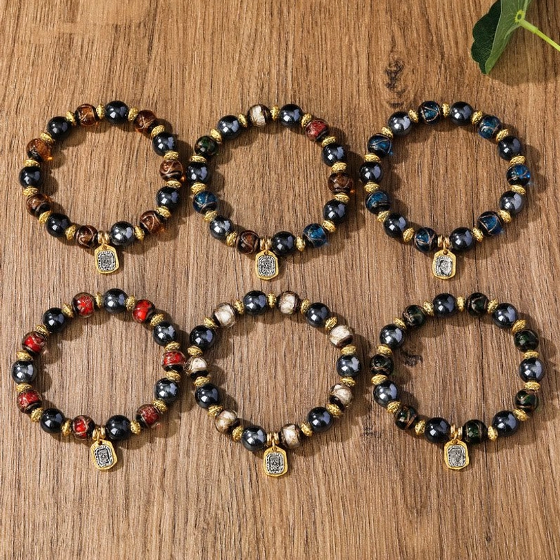 Brown tiger eye style liuli glass wealth bracelet with dark polished beads gold hardware and charm