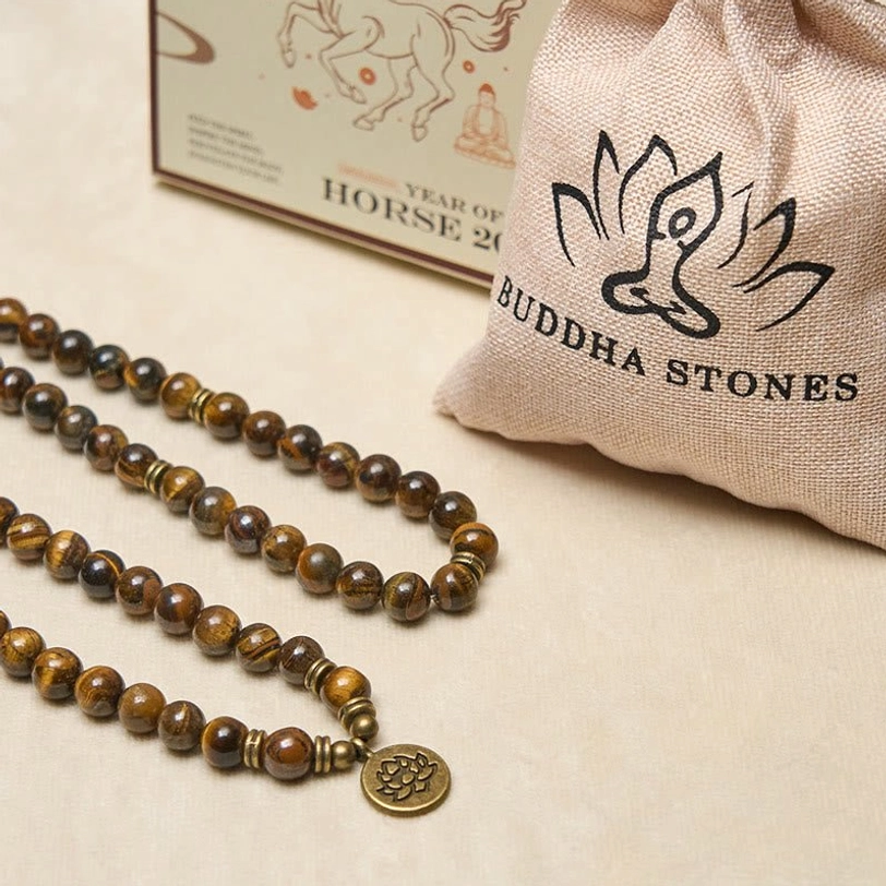 Complete tiger eye mala set including Buddha Stones branded pouch, packaging box, and lotus pendants