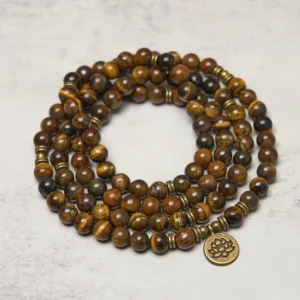 Handcrafted tiger eye stone mala necklace with dark accent beads and metal lotus pendant charm