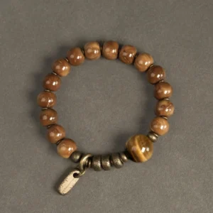 Mixed warm brown tiger eye stone beads with central cat-eye focal bead and brass hardware