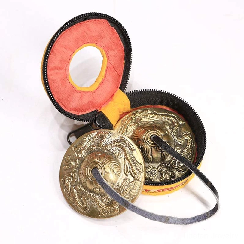 Tibetan tingsha cymbals with dragon design for spiritual protection and courage with embroidered pouch