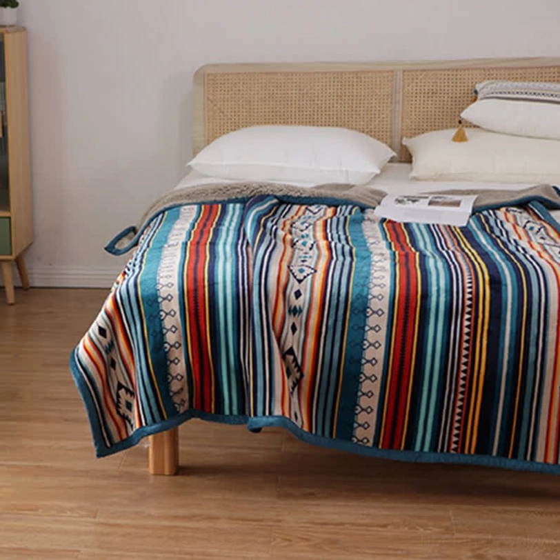 Geometric throw blanket in travel setting showing portability and lightweight comfort for outdoor adventures and camping trips