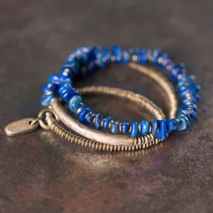 Triple wrap lapis lazuli bracelet set showing layered stacking design with metal tag on leather background