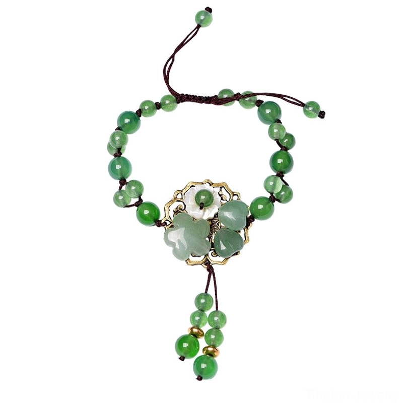 Unisex green jade flower bracelet combining Tibetan crystal traditions with modern minimalist design