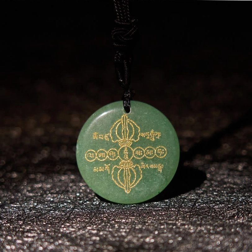 Vajra Dorje Tibetan crystal necklace pendant variation with golden engraved patterns on natural gemstone