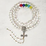 Vajra Liuli 108 mala beads flat lay topdown view transparent crystal beads with metal vajra pendant