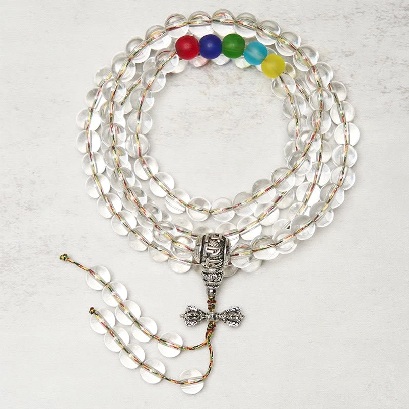Vajra Liuli 108 mala beads flat lay topdown view transparent crystal beads with metal vajra pendant