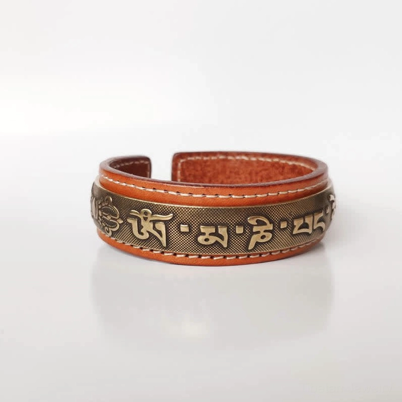 Vajra and Om Mani Padme Hum engraved antique copper cuff bracelet detail