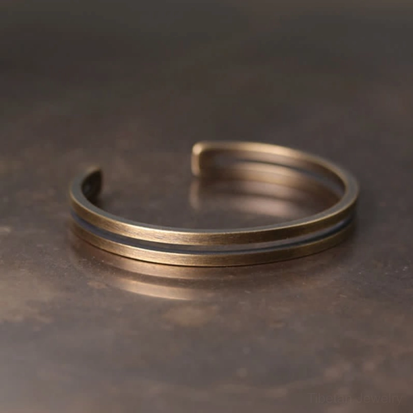 Handcrafted copper Viking open cuff bracelet side angle view highlighting dual parallel band structure