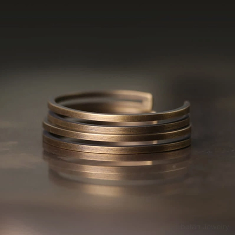Stacked double layer antique copper Viking cuff bracelets layered together showing multiple unit styling