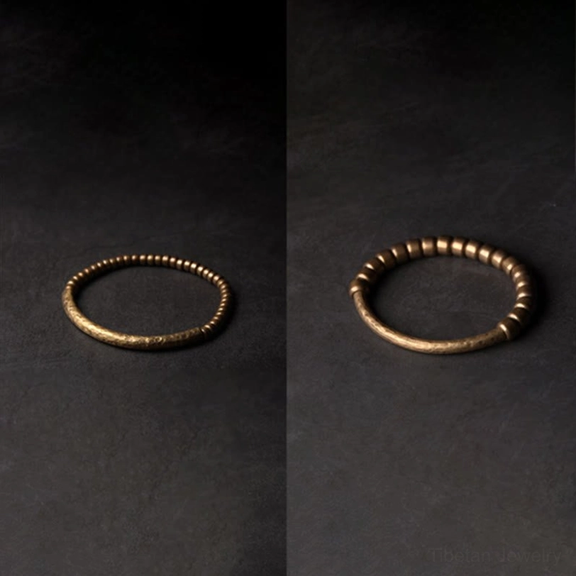 Vintage-style copper brass prosperity bracelet with aged bronze tone, showcasing natural material beauty and spiritual significance