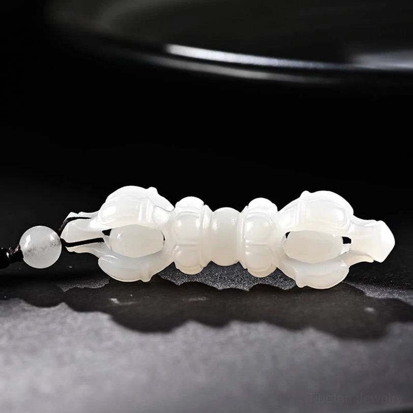 White Hetian Jade Dorje Vajra pendant necklace representing protection, blessing, and spiritual harmony in Tibetan Buddhism