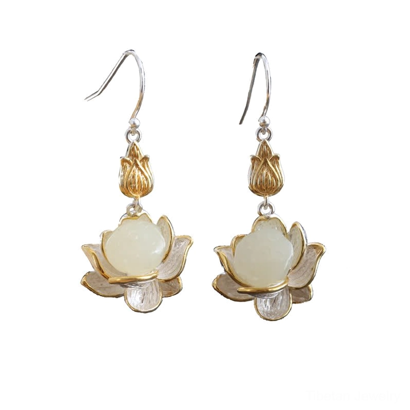 White jade lotus drop earrings with packaging and care instruction materials for eco-friendly handmade jewelry