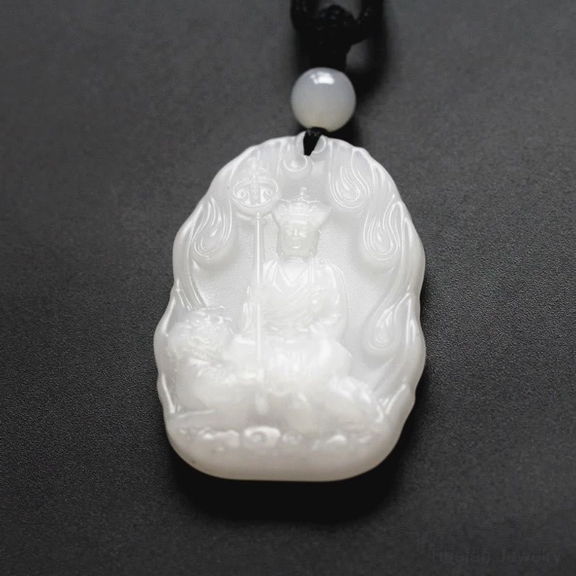 Pure white matte finish Ksitigarbha Buddha crystal pendant with flame carved border, seated Bodhisattva holding staff, black braided cord with white bead accent