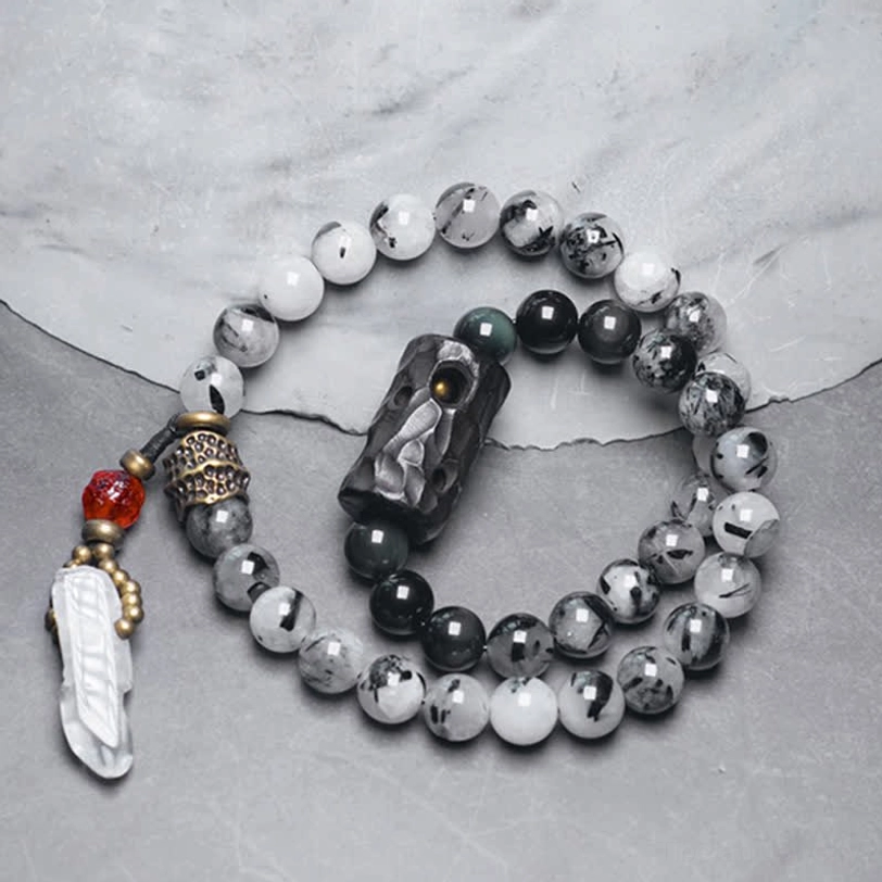 Women's couple bracelet set with black rutilated quartz ebony wood white crystal flat lay