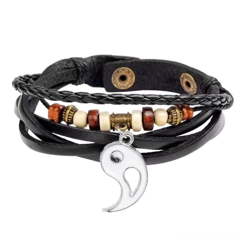 White yin yang leather bracelet with braided design and metal yin yang charm