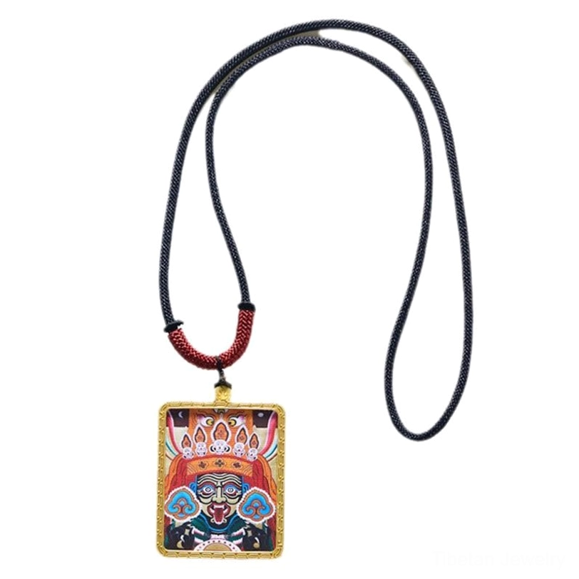 Blue Zakiram deity thangka pendant featuring hand-painted blue protector goddess with gold frame and traditional necklace cord