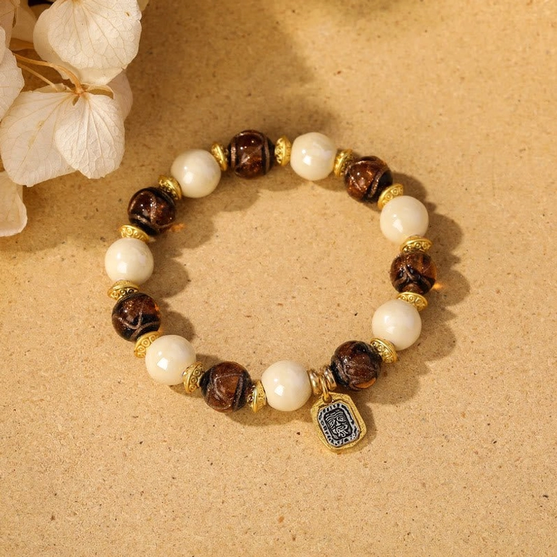 Beige incense ash porcelain with brown liuli glass Tibetan wealth goddess charm bracelet