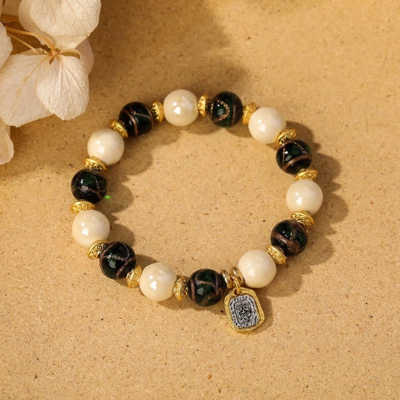 Green liuli glass beads combined with beige incense ash porcelain in Tibetan Zakiram wealth bracelet
