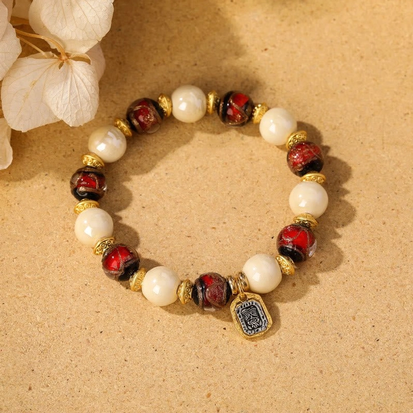 Beige porcelain with red liuli glass Tibetan Zakiram goddess bracelet symbolizing prosperity and abundance