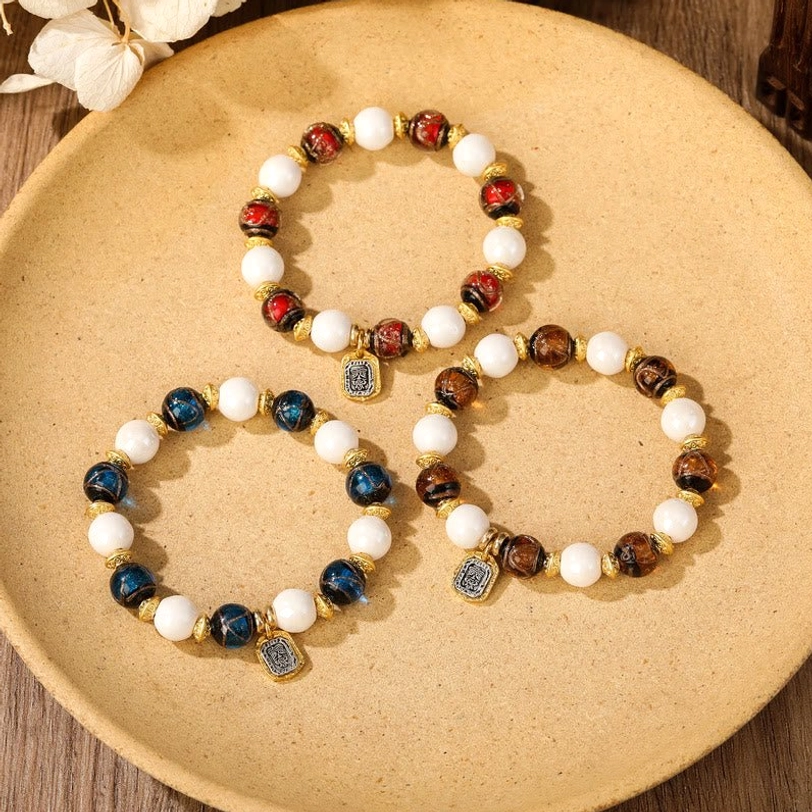Tibetan wealth goddess Zakiram bracelet with engraved charm pendant and spiritual symbolism