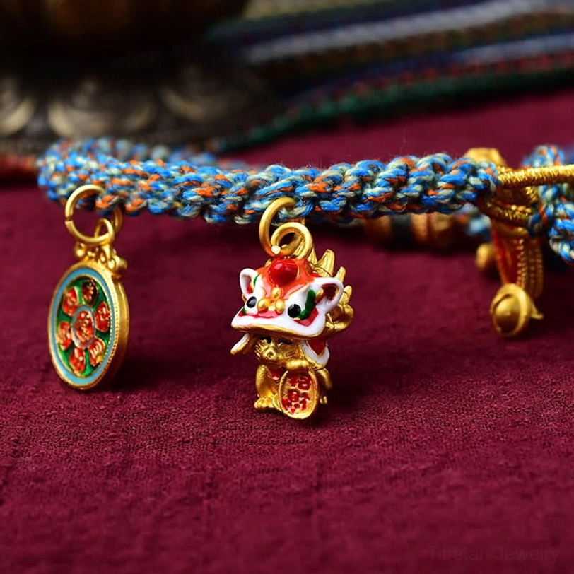 Zakiram blessing bracelet close-up showing lion dance charm and enamel embellishments