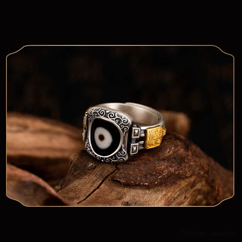 Adjustable Zakiram Dzi bead ring front three-quarter perspective showing retro silver-gold color matching and traditional scroll patterns