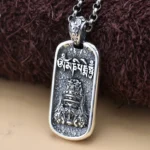 925 sterling silver Zakiram Goddess of Wealth pendant front view with Om Mani Padme Hum mantra, antique finish on brown background
