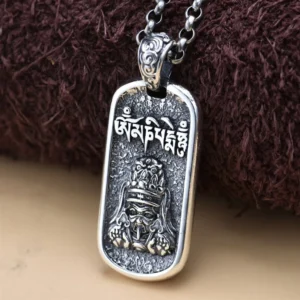 925 sterling silver Zakiram Goddess of Wealth pendant front view with Om Mani Padme Hum mantra, antique finish on brown background