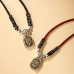 Zakiram goddess Tibetan sterling silver pendant necklaces collection - red and black braided rope styles with engraved face charm flat lay