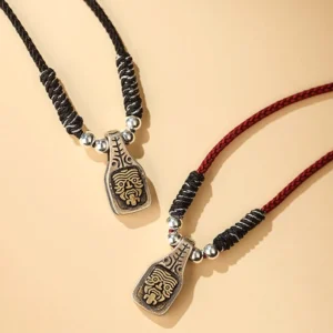 Zakiram goddess Tibetan sterling silver pendant necklaces collection - red and black braided rope styles with engraved face charm flat lay
