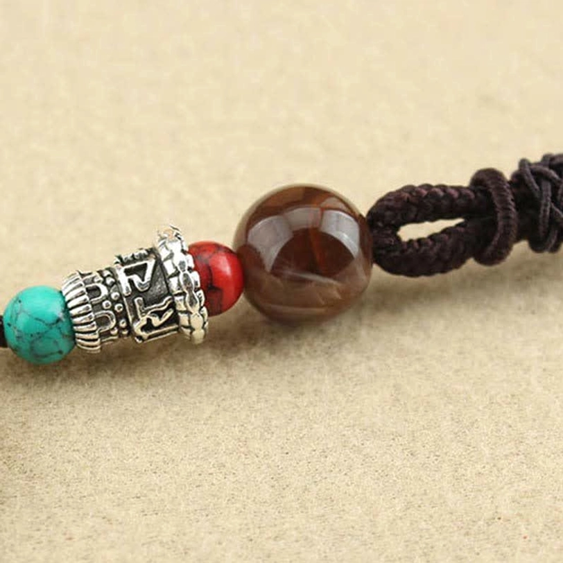 Zakiram Goddess of Wealth Tibetan thangka pendant with feminine divine energy and prosperity blessing design