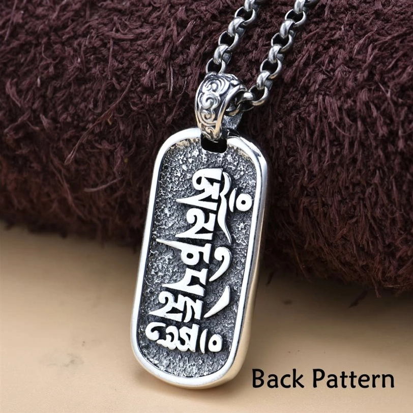 Reverse back side of Zakiram pendant showing Tibetan mantra inscription and back pattern detail