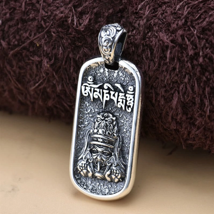 Zakiram Goddess pendant three-quarter side angle showing detailed embossed relief carving and protective deity iconography