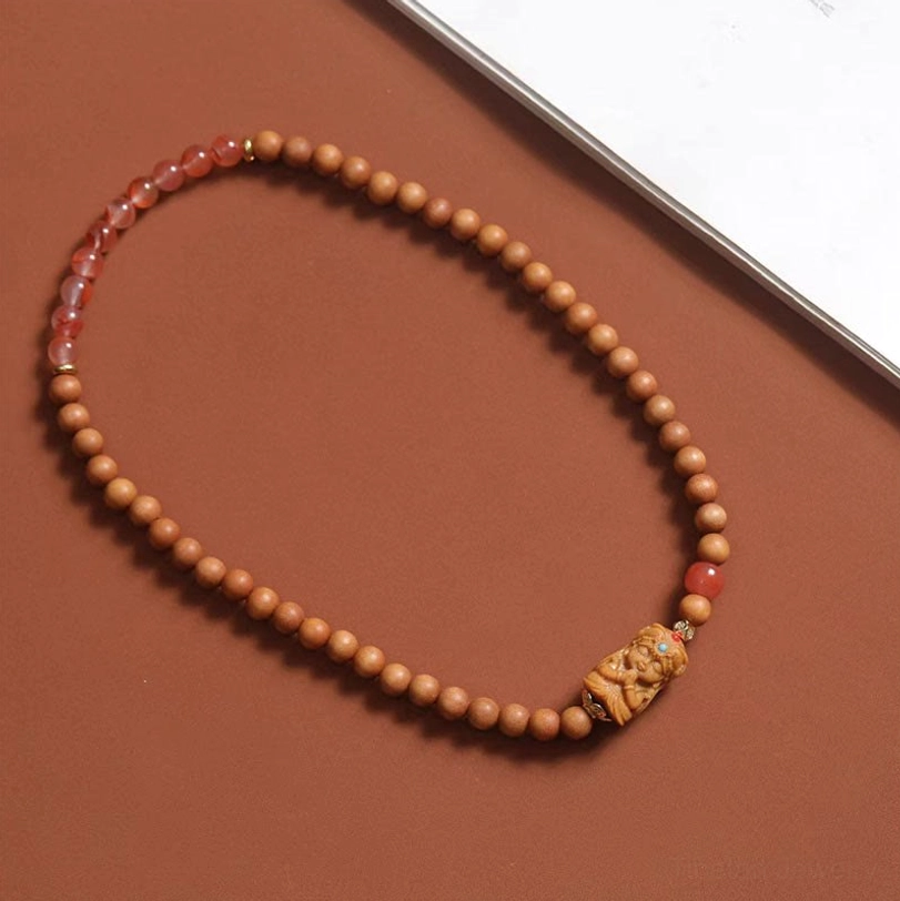 Long Zakiram prayer bead strand with small sandalwood beads and South Red Agate accents, full length spiritual bracelet display