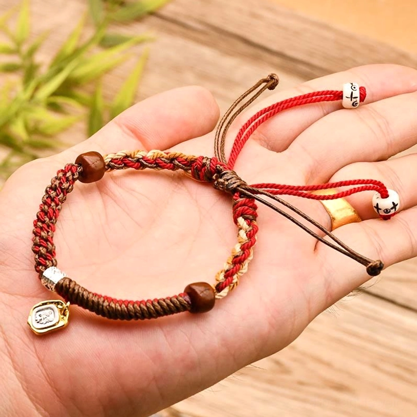 Red Zakiram goddess of wealth tibetan protection bracelet with adjustable knots and sacred metal pendant
