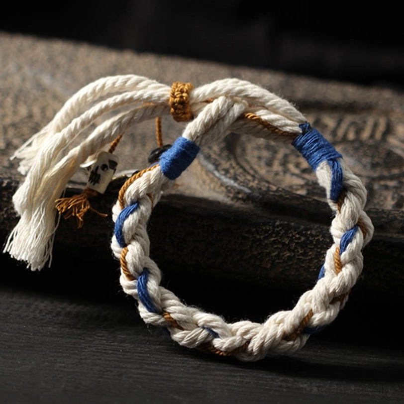 Tibetan Zakiram wealth bracelet displaying copper accents and premium cotton string construction in traditional design