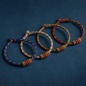 Complete collection of Chinese zodiac natal Buddha bracelets in multiple colors with woven cord designs