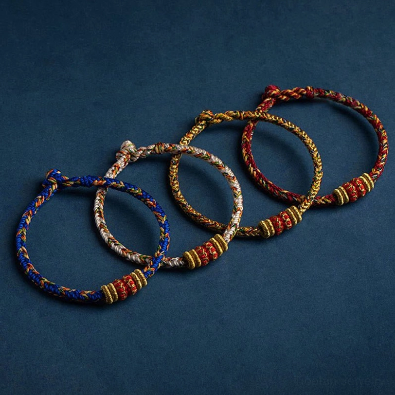 Complete collection of Chinese zodiac natal Buddha bracelets in multiple colors with woven cord designs